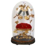A Victorian glass dome on plinth, H49cm, containing a velvet and gilt-metal stand, mirrors and