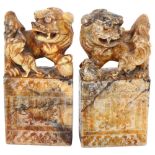A pair of carved stone Kylin figure seals, H17.5cm