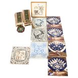 A collection of various Victorian tiles, and a framed pot stand tile