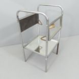 A mid-century modernist chrome tubular steel side table with mirrored shelves. 40x73x36cm (extending