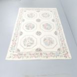 A cream-ground needlepoint floral-design wall hanging. 190x130cm.