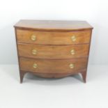 A George III mahogany bow-front chest of three long drawers. 108x93x56cm.
