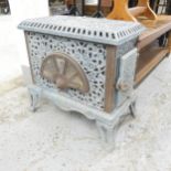 An early 20th century French Art Nouveau style woodburning stove, marked Pied-Selle Brevet.