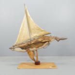 CLIVE FREDRIKSSON - A carved wood steampunk sculpture of a blue whale boat, with signed plaque.