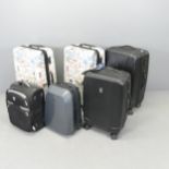 Six various wheeled suitcases including by Portland Luggage and Travel Pro.