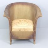 A 1930s Lloyd Loom armchair with upholstered seat, with original gold finish. Date mark for 1937