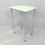 A mid-century modernist chrome tubular steel side table with green top. 46x73x36cm.