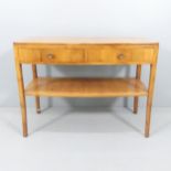 A Heals mid-century yew wood side table, with two drawers and maker's ivorine disc. 107x80x49cm