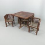 HEALS - a 1920s teak slatted garden table and four nesting chairs, with label for Castle's