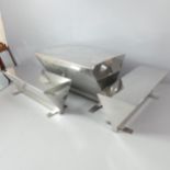 A contemporary designer mirror polished stainless steel table, 123x74x79cm, and two matching