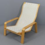 A Scandinavian design bent ply reclining lounge chair with webbed seat.