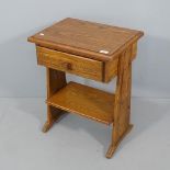 An oak sewing table with single drawer and shelf under. 50x66x38cm.