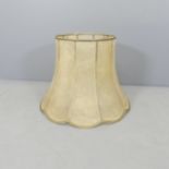 A vintage hide lampshade. 60x44cm (top diameter 36cm).