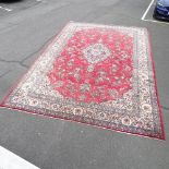 A large red ground Qashqai carpet. 523 x 346cm.