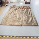 A pair of brown silk curtains, lined and interlined. Drop 239cm, Width (top) 158cm, (base) 246cm.