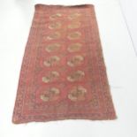 A red-ground Afghan rug. 210x115cm.