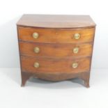 A George III mahogany bow-front chest of three long drawers. 93x89x57cm.