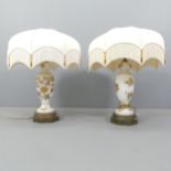 A pair of impressive glass table lamps with applied gilded floral designs, on pierced brass shaped