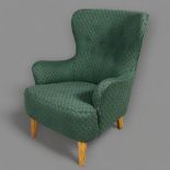 Theo Ruth, a mid-century wing armchair for Artifort, with later green fabric upholstery, height 91cm