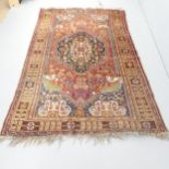 A red-ground Quashqai rug. 236x150cm.