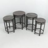 A nest of 4 Chinese circular hardwood occasional tables, with carved friezes, largest table diameter