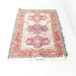 A red and cream-ground Caucasian Sumak Kilim rug. 150x110cm.