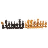 An 18/19th century French Regence pattern chess set, turned boxwood and ebony pieces, king 73mm high