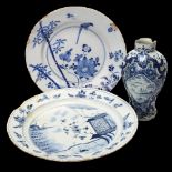 2 x 18th century Delft blue and white pottery chargers, largest 34cm diameter, and a Delft relief