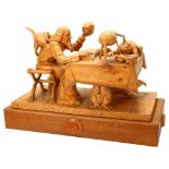 Ian Norbury, superb quality lime wood carving, Merlin, seated at a table and holding skull and