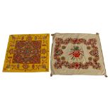 2 early 20th century crewel embroidered panels, 58cm across, 1 with a rope border, the other mounted