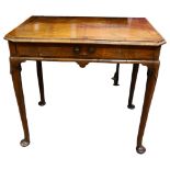 George II Period walnut side table, the feather banded and quarter veneered canted top above a