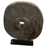 An Ancient wooden cartwheel on modern stand, overall height 72cm