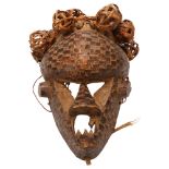A wood carved tribal mask with basket weave and copper detail, probably Salampasu, Congo, length