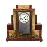 A French Art Deco multi-colour marble-cased mantel clock, with 8-day striking movement, case