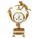 A French alabaster and gilt-bronze mounted mantel clock, surmounted by a child holding a moth to a