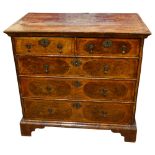 A William and Mary Period walnut chest of drawers, crossbanded top above 2 short and 3 long