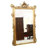A 19th century pier mirror with bevelled glass and Rococo style gilt frame, height 150cm, width 91cm