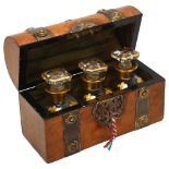 A 19th century brass-bound walnut dome-top perfume bottle case, containing 3 original gilded glass