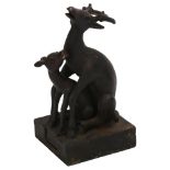A Chinese patinated bronze desk seal, in the form of 2 interlocking deer, height 11.5cm