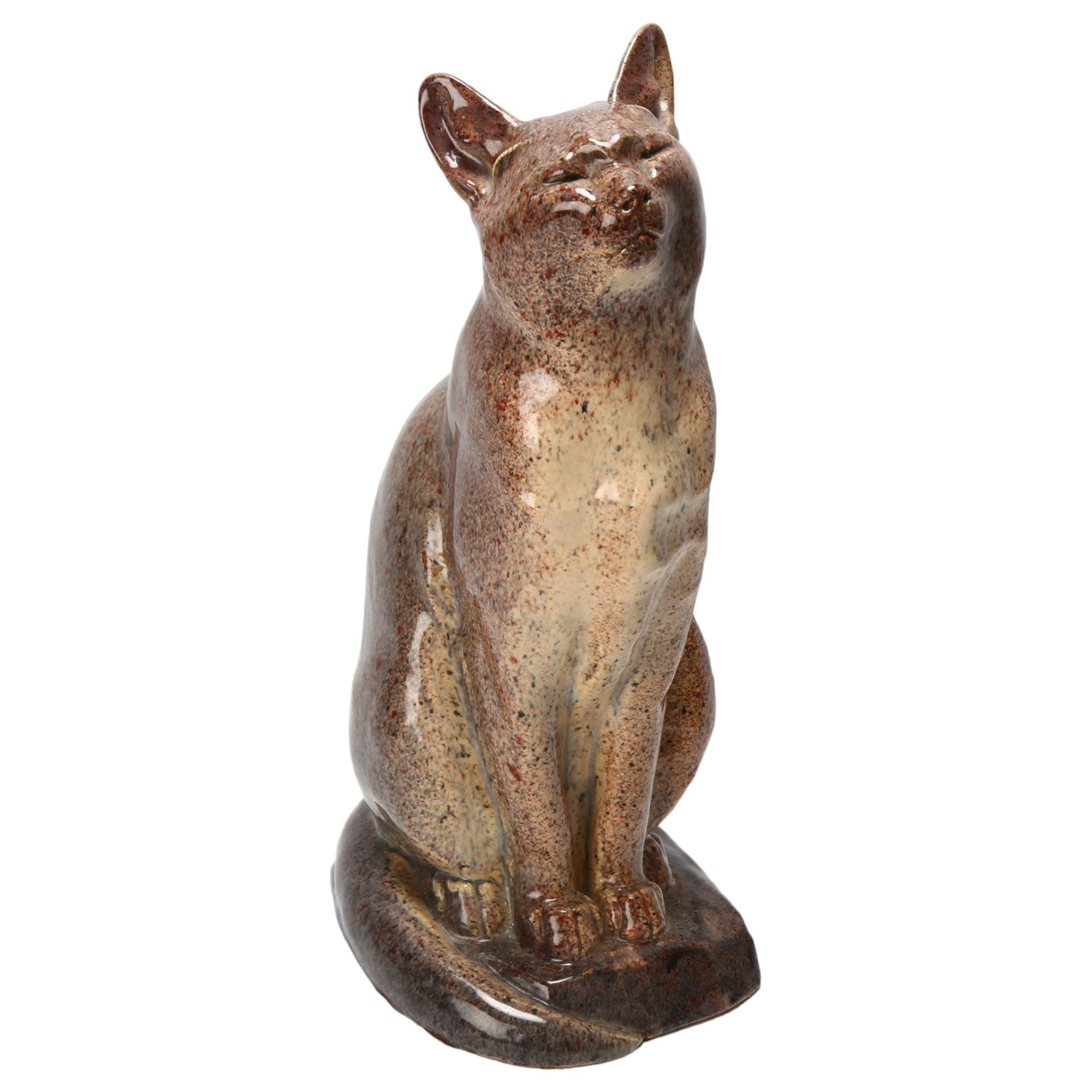 An art deco ceramic cat with mottled glaze, makers stamps to base Marcel Guilliard, Editions Etling,