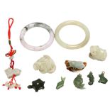 A group of Chinese jade and hardstone carvings, bangles and pendants