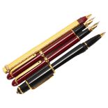 A Must de Cartier black ballpoint pen, together with a Cartier gold plated pen a/f, and two