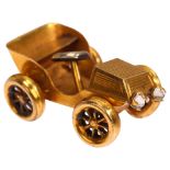 An early 20th century 9ct gold Classic car charm/pendant, length 21.8mm, 1.5g Car and wheels