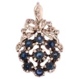 A late 20th century sapphire and diamond target cluster pendant, unmarked white metal settings