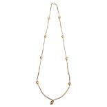 A 9ct gold fancy link chain necklace, with ball spacers, length 66cm, 24g No damage or repair, clasp