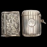 An Edwardian silver Vesta case of curved rectangular form, Birmingham 1911, length 5cm, and an
