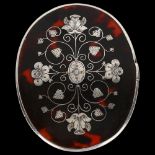 A small oval tortoiseshell and picquet inlaid travelling mirror, probably mid-19th century, 9cm x