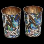 A pair of small Chinese silver and enamel drinking tots, with bird and blossom designs, impressed