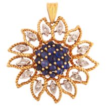 A mid 20th century French gold sapphire and diamond flowerhead pendant, set with round cabochon