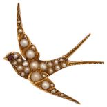 An Edwardian pearl and ruby swallow bird brooch, circa 1905, unmarked gold settings, wingspan 41.